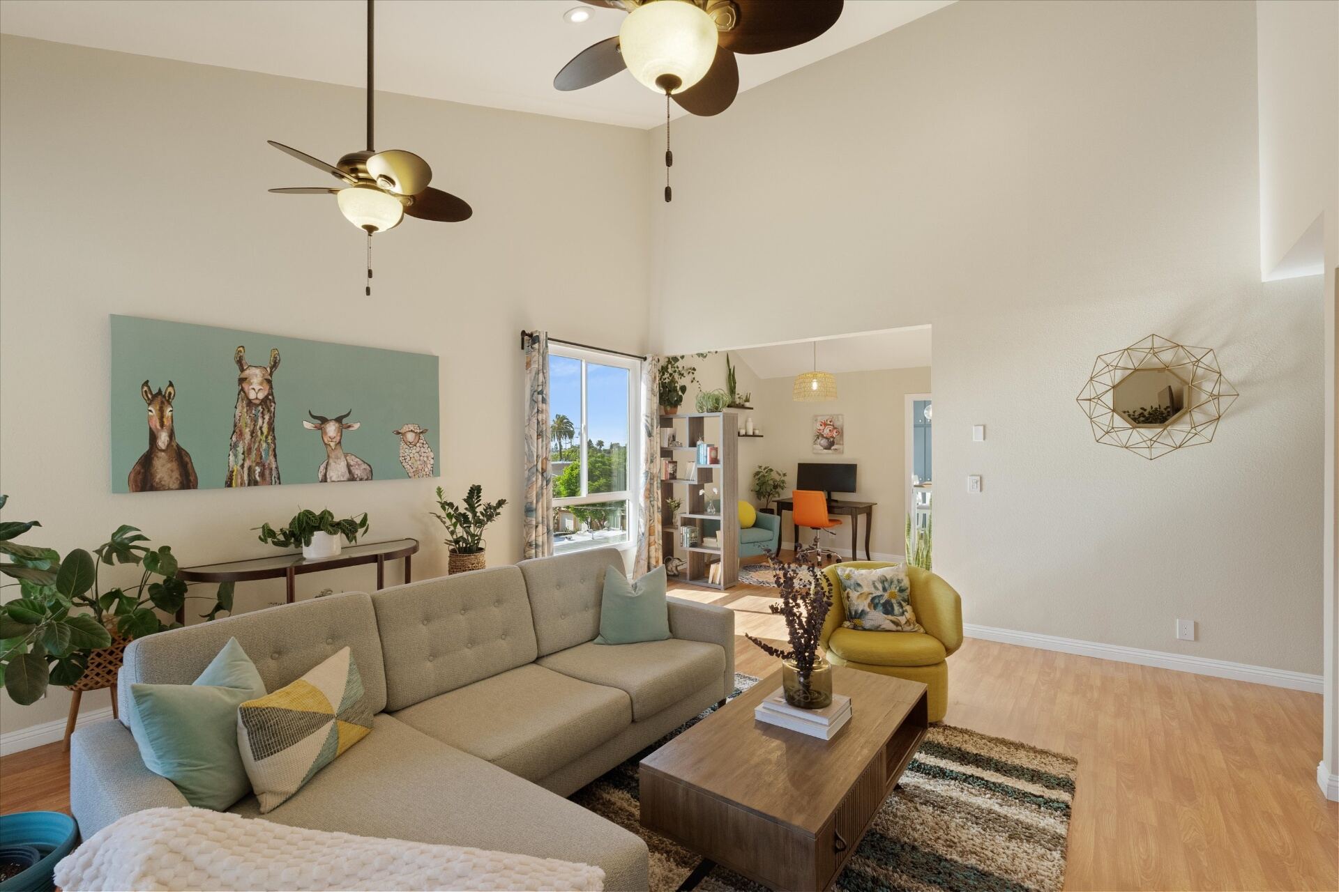 Open living room with sectional sofa and high ceilings