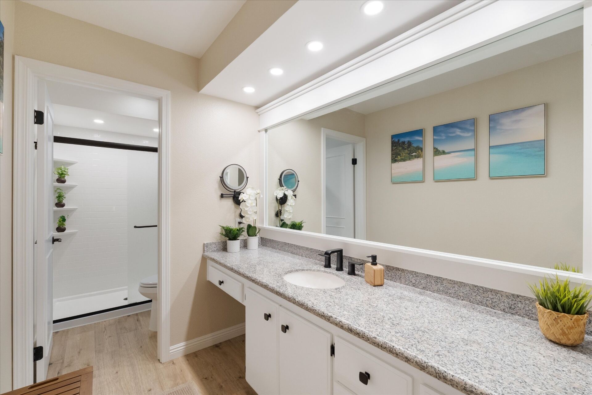 Updated primary en-suite with extended granite vanity and large mirror